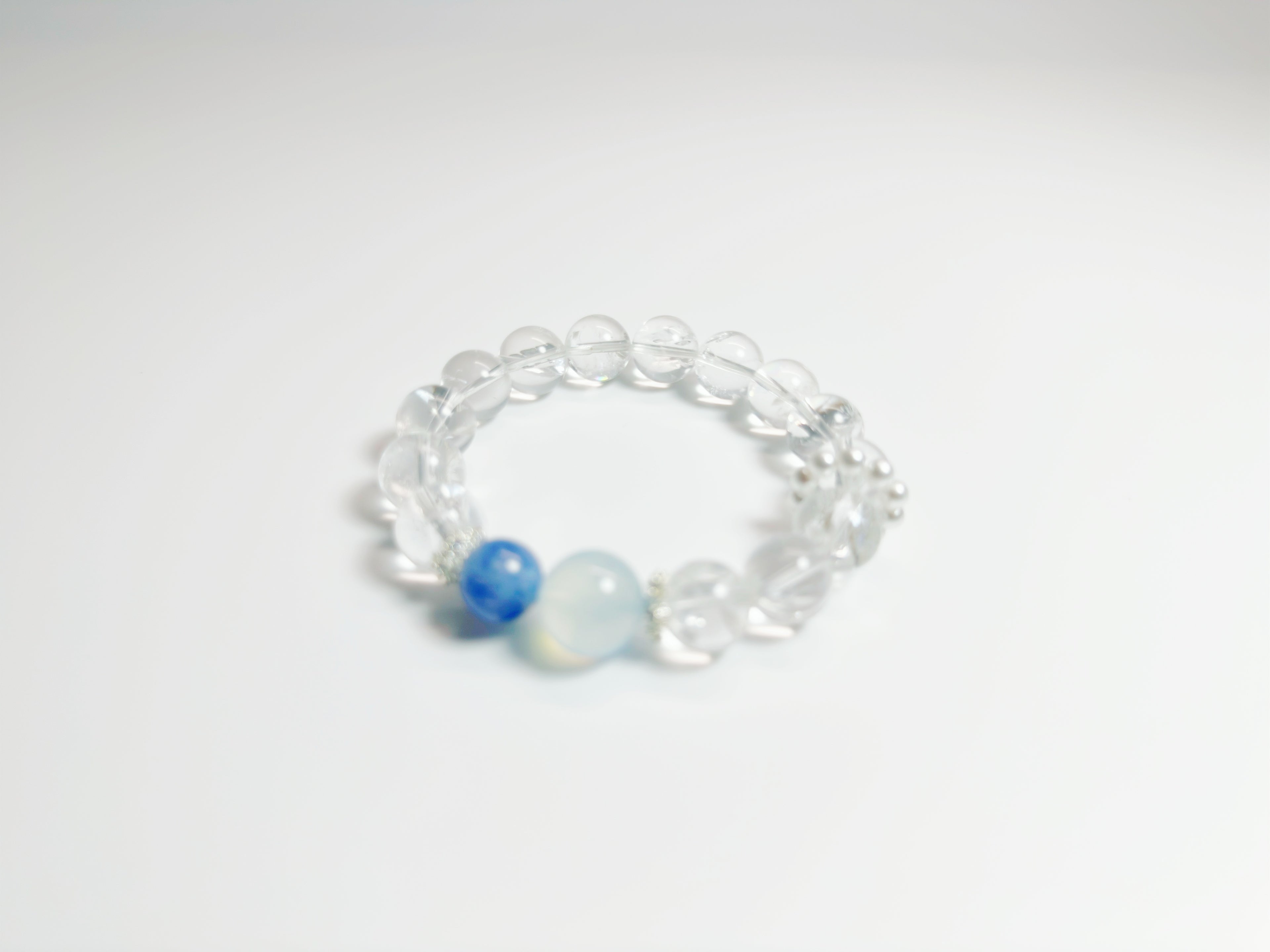 Feng Shui -Clear Quartz -Kyanite  -Alternating clear quartz and icy-blue kyanite cylinders create a glacier-cool palette that pairs effortlessly with office or evening wear. Enhances clarity & peaceful energy.