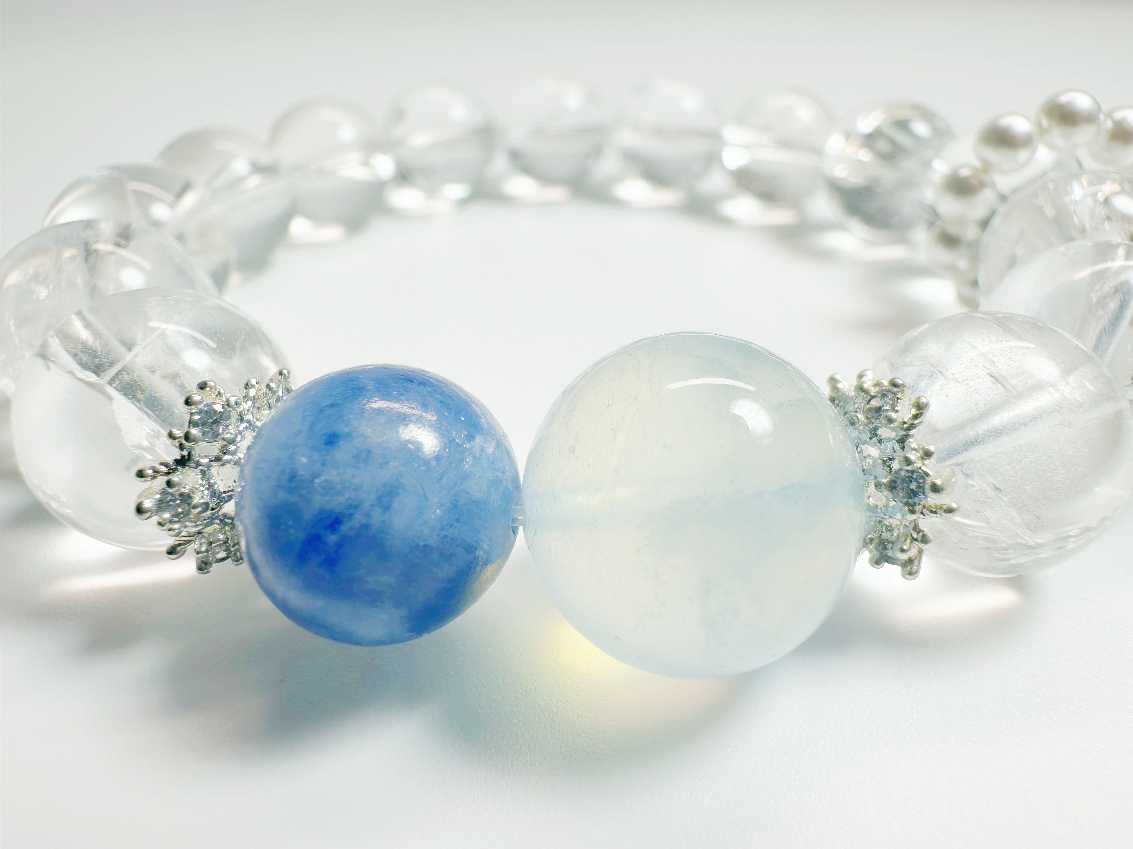 Feng Shui -Clear Quartz -Kyanite  -Alternating clear quartz and icy-blue kyanite cylinders create a glacier-cool palette that pairs effortlessly with office or evening wear. Enhances clarity & peaceful energy.