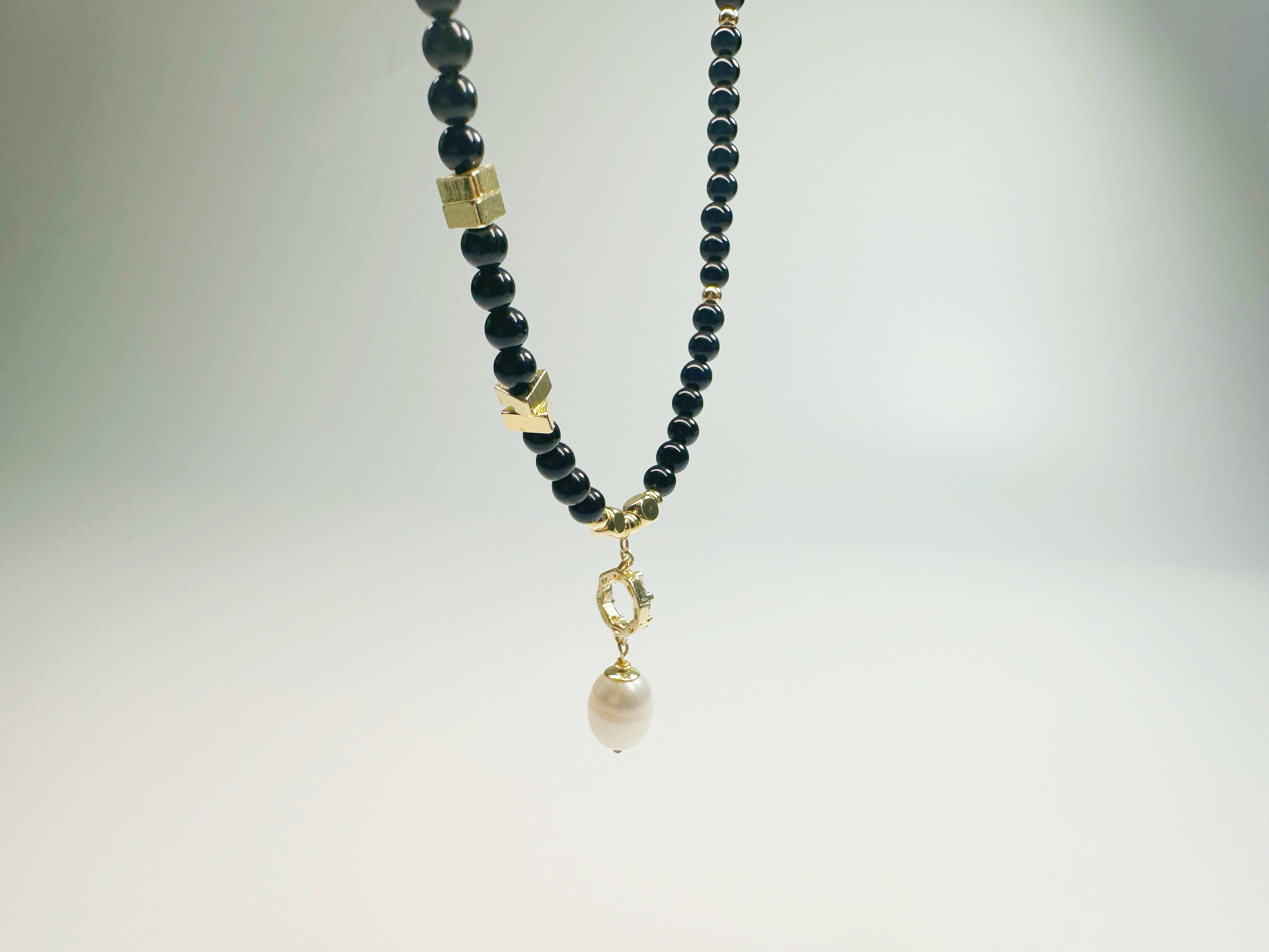 The Jìng(静):  Feng Shui Black Agate & Pearl bracelet for protection + intuition boost. Hand-polished metaphysical talisman with optional Baiyun Temple blessing. Shields against negative energy .