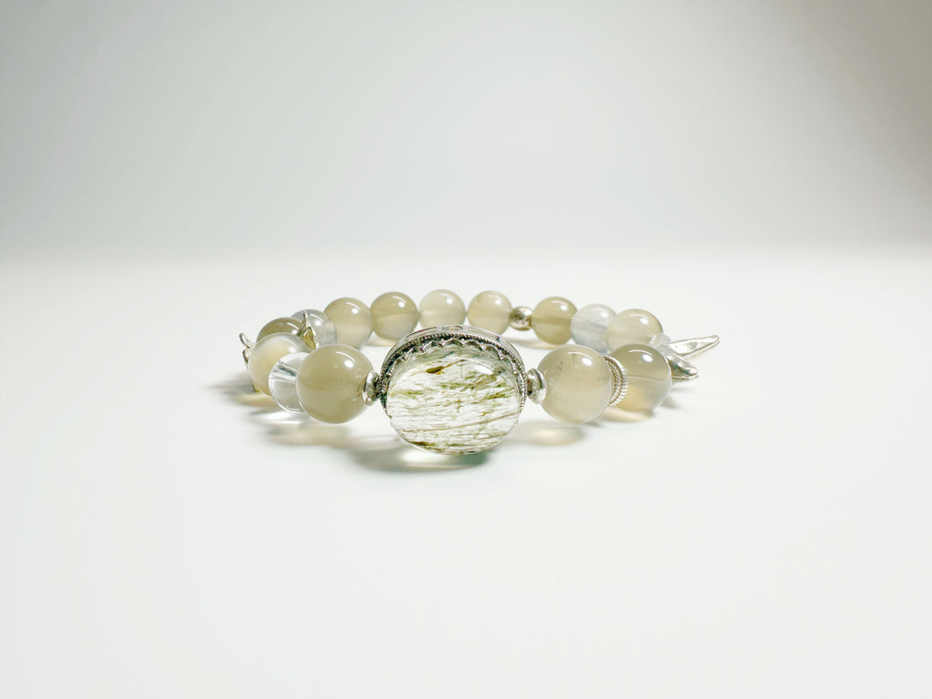 Feng Shui Stone & moonstone garden pendant with tourmaline quartz. Combines silver moonstone clarity + green tourmaline protection. Optional Baiyun Temple blessing for cosmic energy alignment.